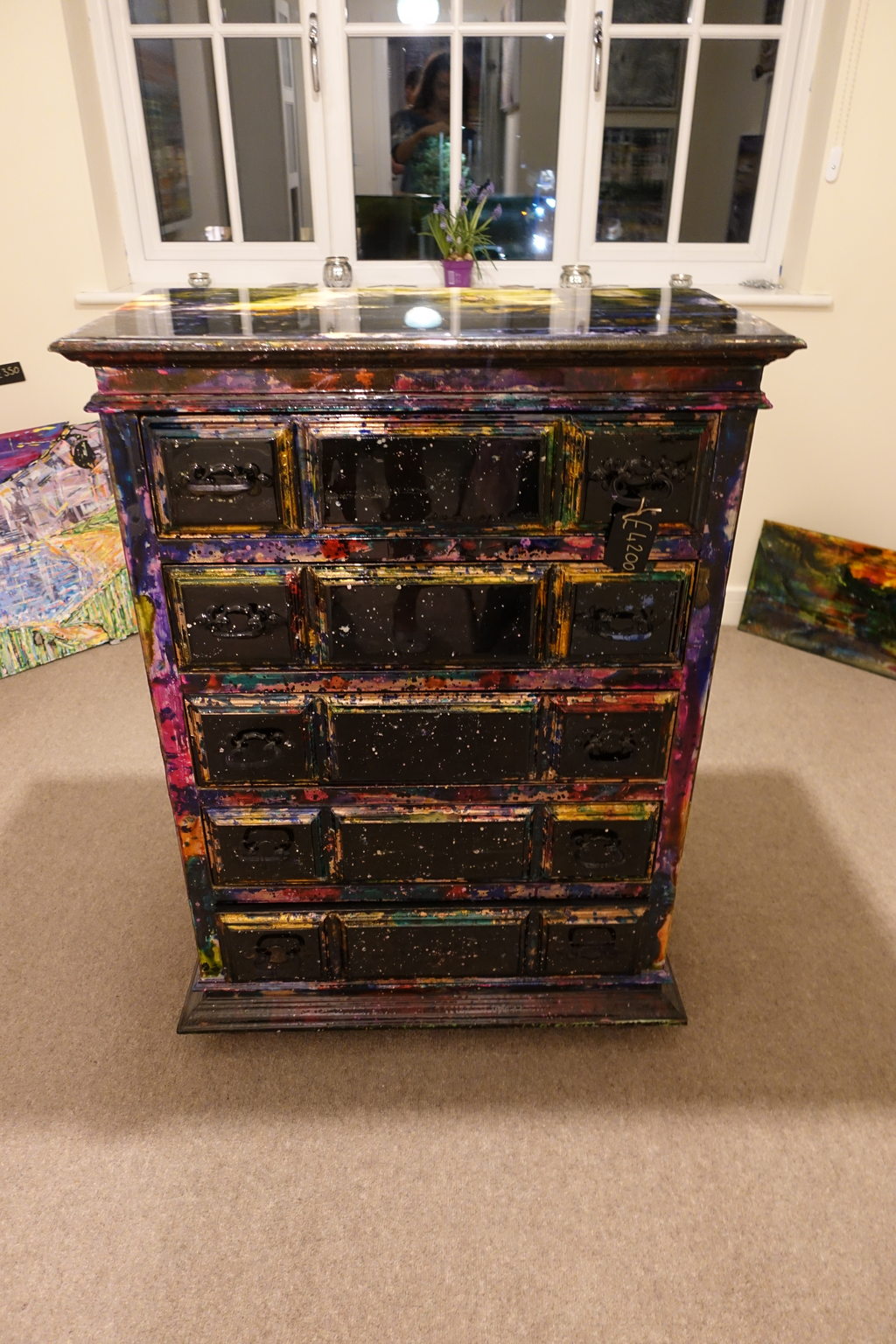 Chest of drawers painted in dense multicolour