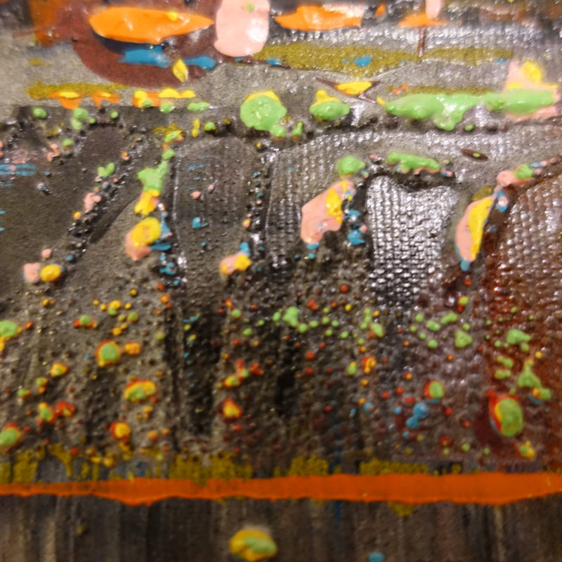 Macro detail: orange line over black impasto