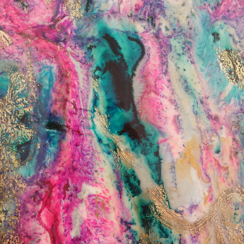 Macro detail: pink, teal and gold marbling