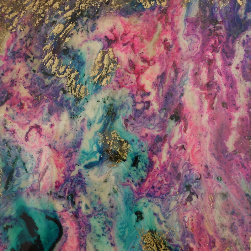 Macro detail: pink, teal and gold marble