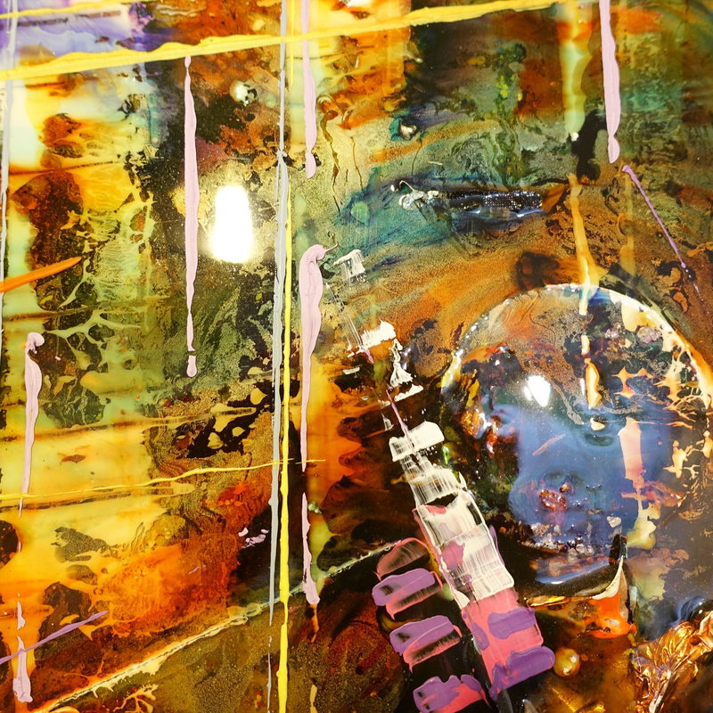 Macro detail: amber pour with a trapped bubble