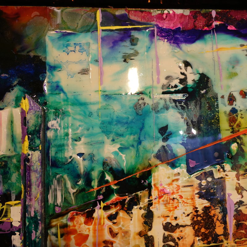 Macro detail: teal and violet resin pooling, sold work