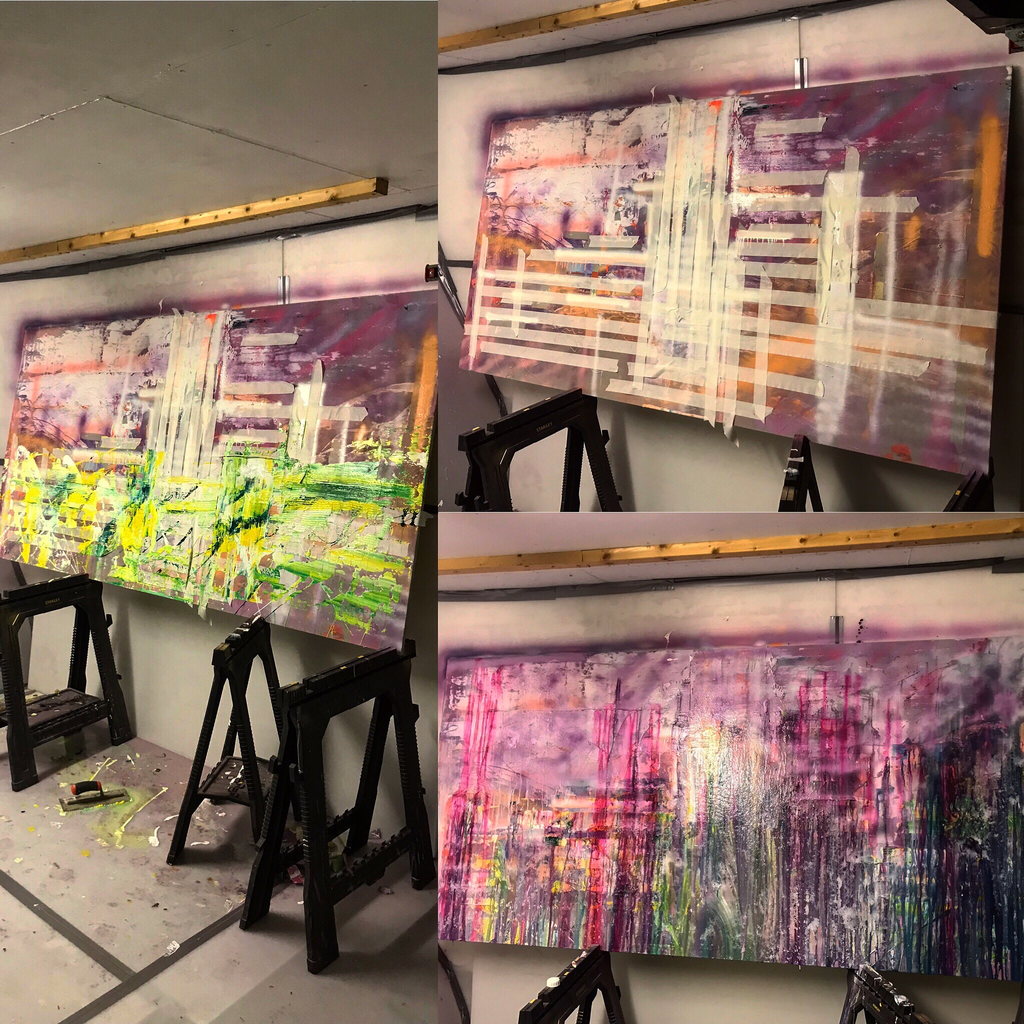 Paintings in progress on easels and trestles in the studio